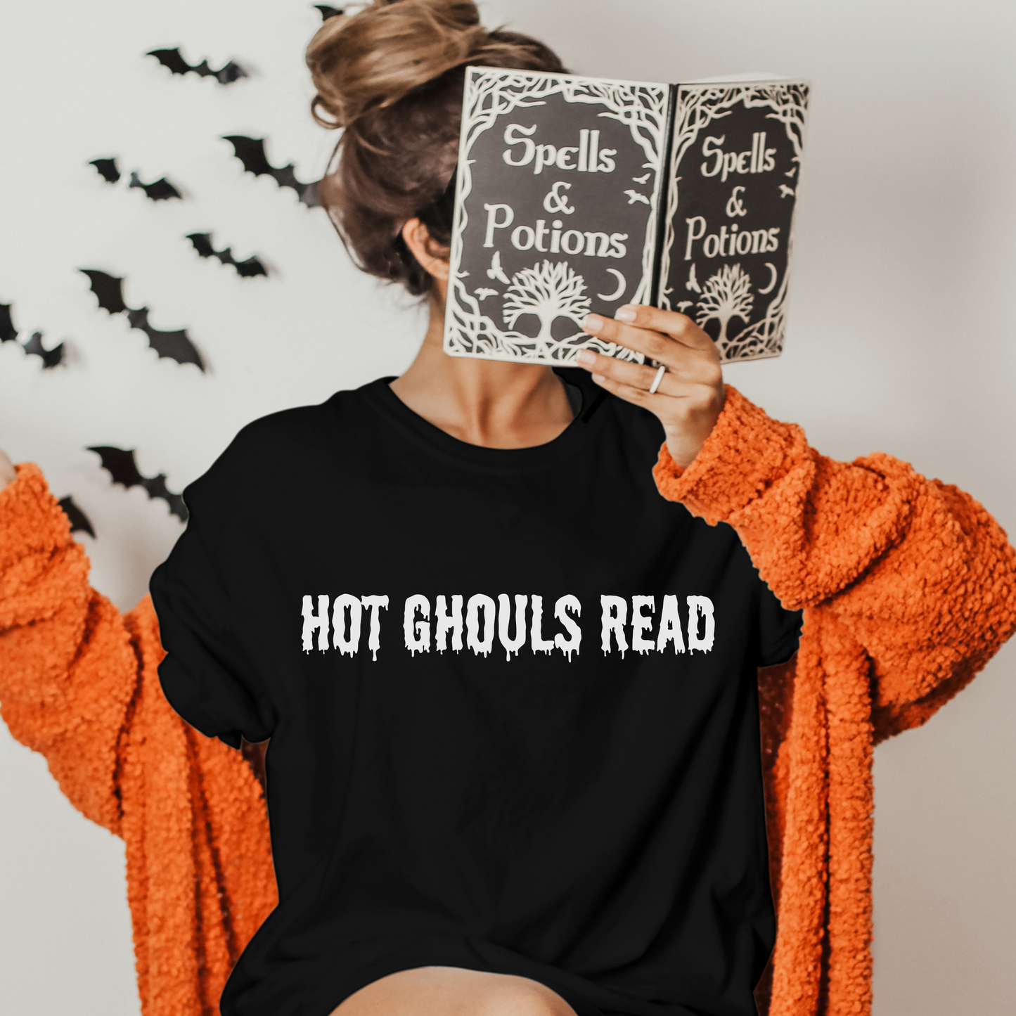 Unleash your inner bookworm as you wrap yourself in the pages of your favorite reads, all while embracing the spine-tingling atmosphere of Halloween. This isn't just any crewneck shirt; it's a statement of your love for literature, entwined with the captivating mystery of the season